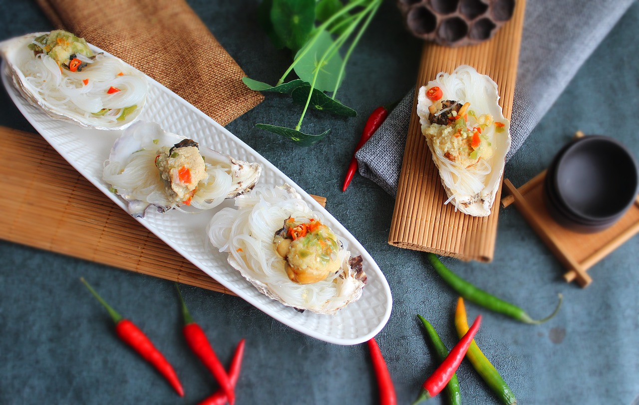 A plate of oysters surrounded by a beautiful decoration